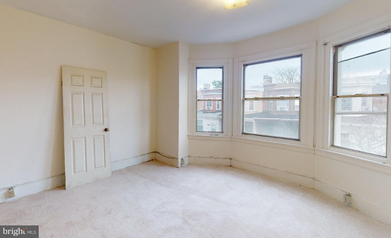 3936 North 8th Street Philadelphia, PA 19140 - Photo 4 of 5 an empty room with windows