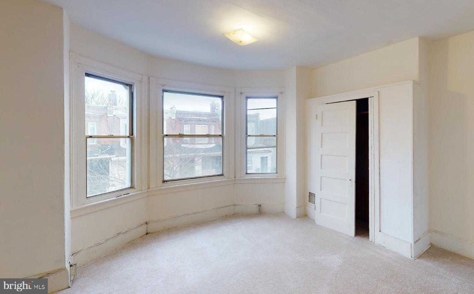 3936 North 8th Street Philadelphia, PA 19140 - Photo 5 of 5 an empty room with windows