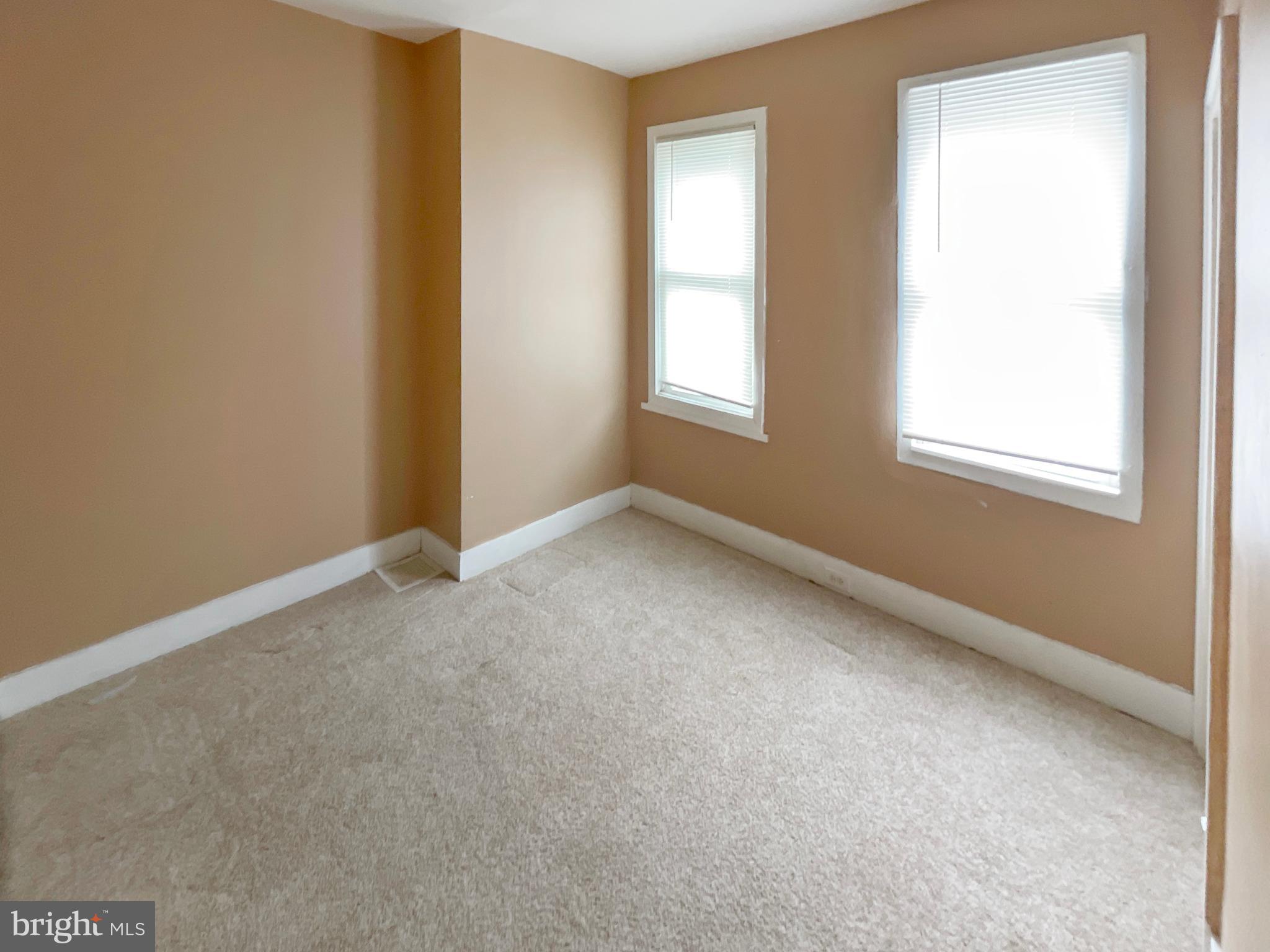 3936 North 8th Street Philadelphia, PA 19140 - Photo 8 of 10 an empty room with windows