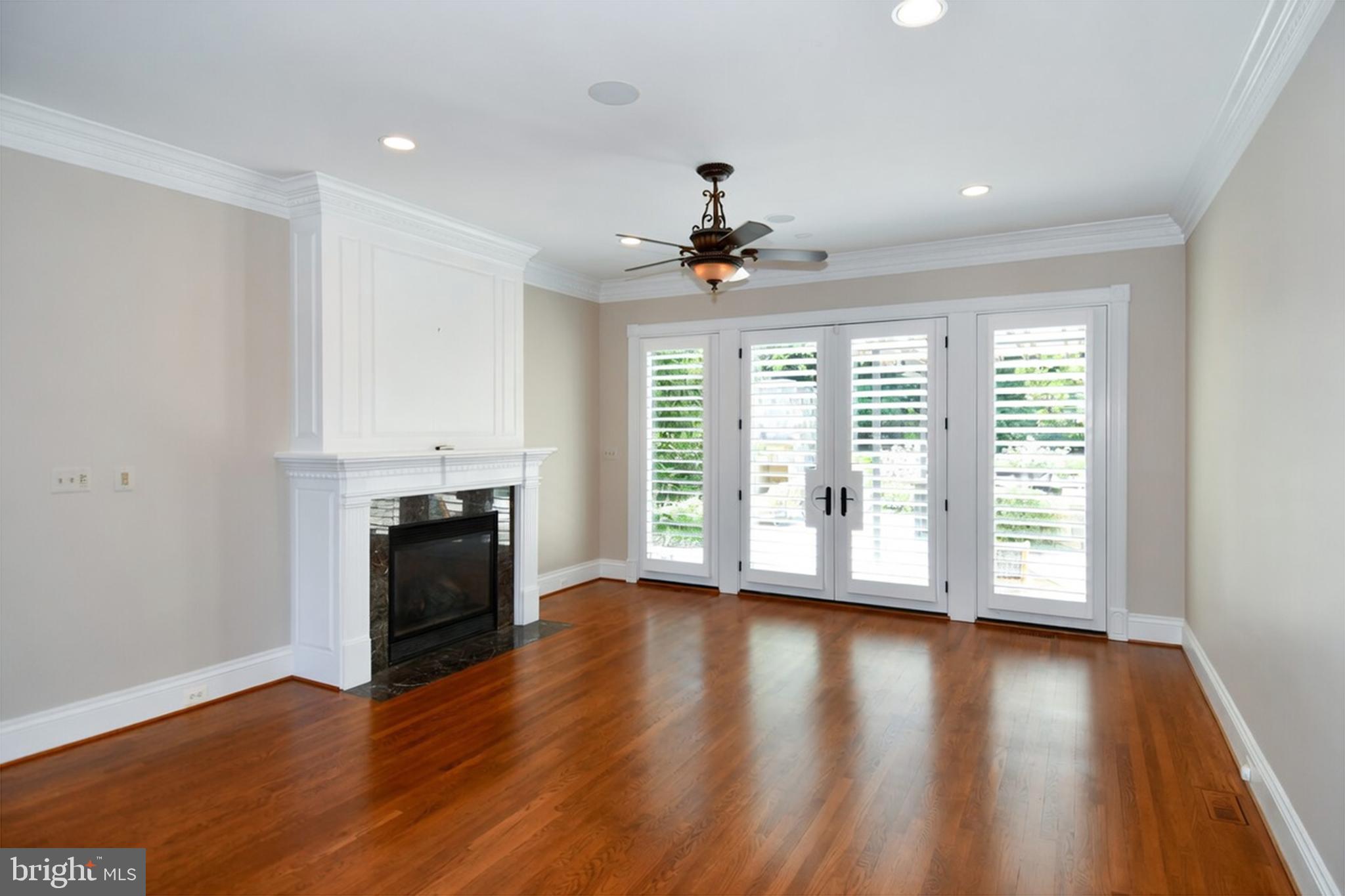 7808 Southdown Road Alexandria, VA 22308 - Photo 34 of 99 a view of an empty room with wooden floor and a window