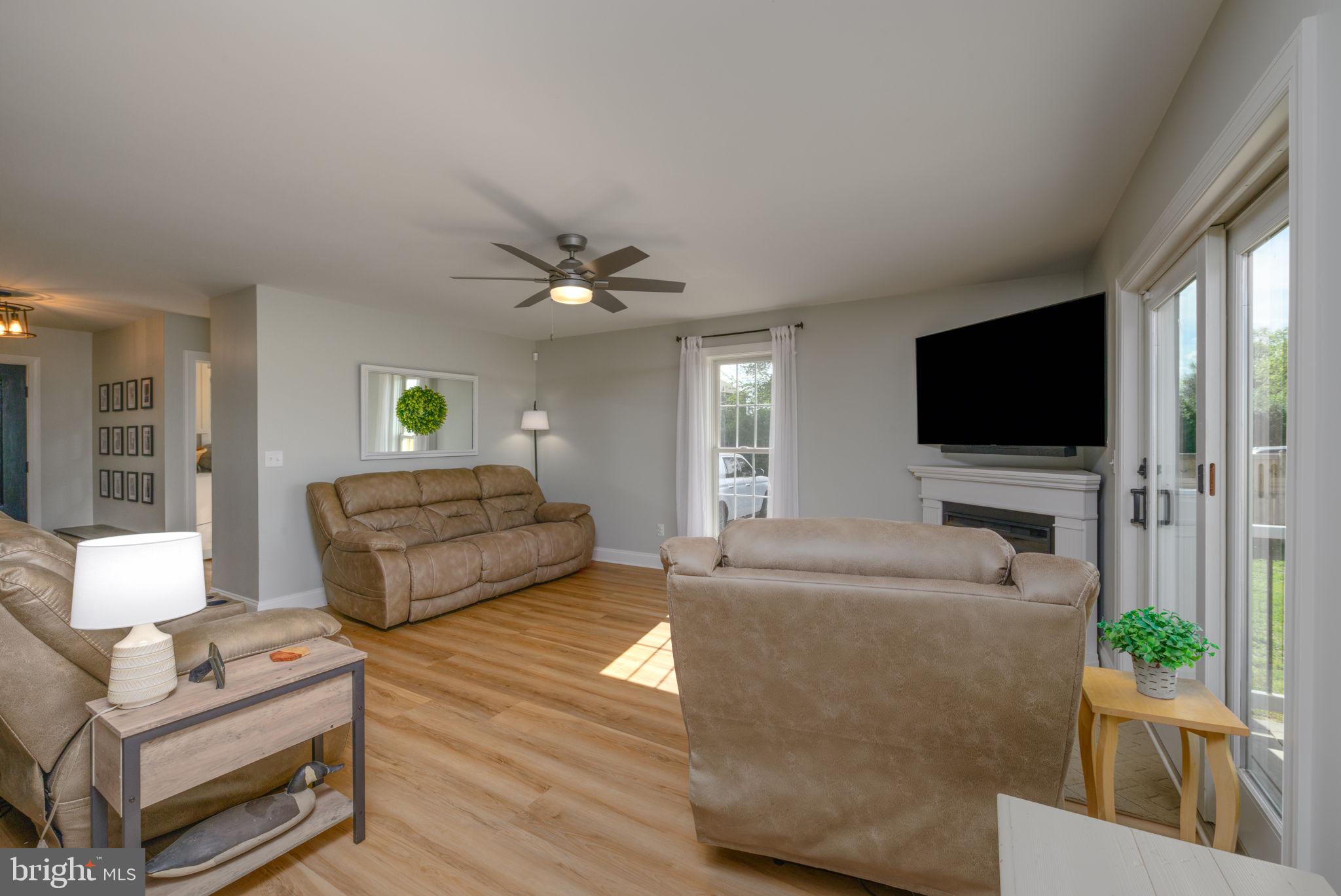 2649 Roberts Station Road Ingleside, MD 21644 - Photo 18 of 47 a living room with furniture and a flat screen tv