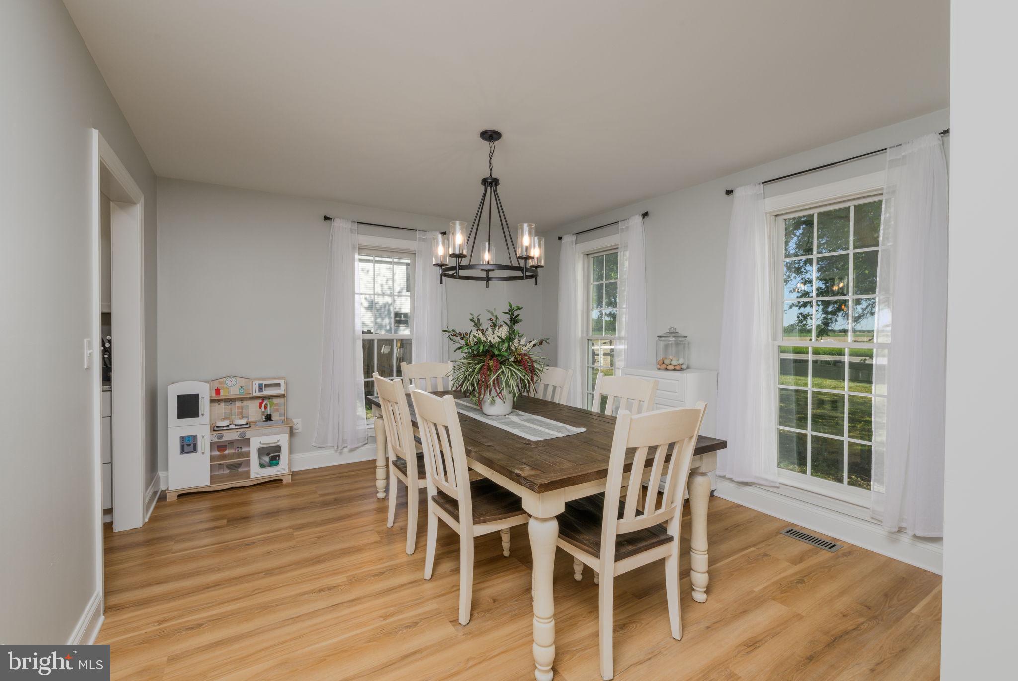 2649 Roberts Station Road Ingleside, MD 21644 - Photo 22 of 47 a view of a dining room with furniture window and wooden floor