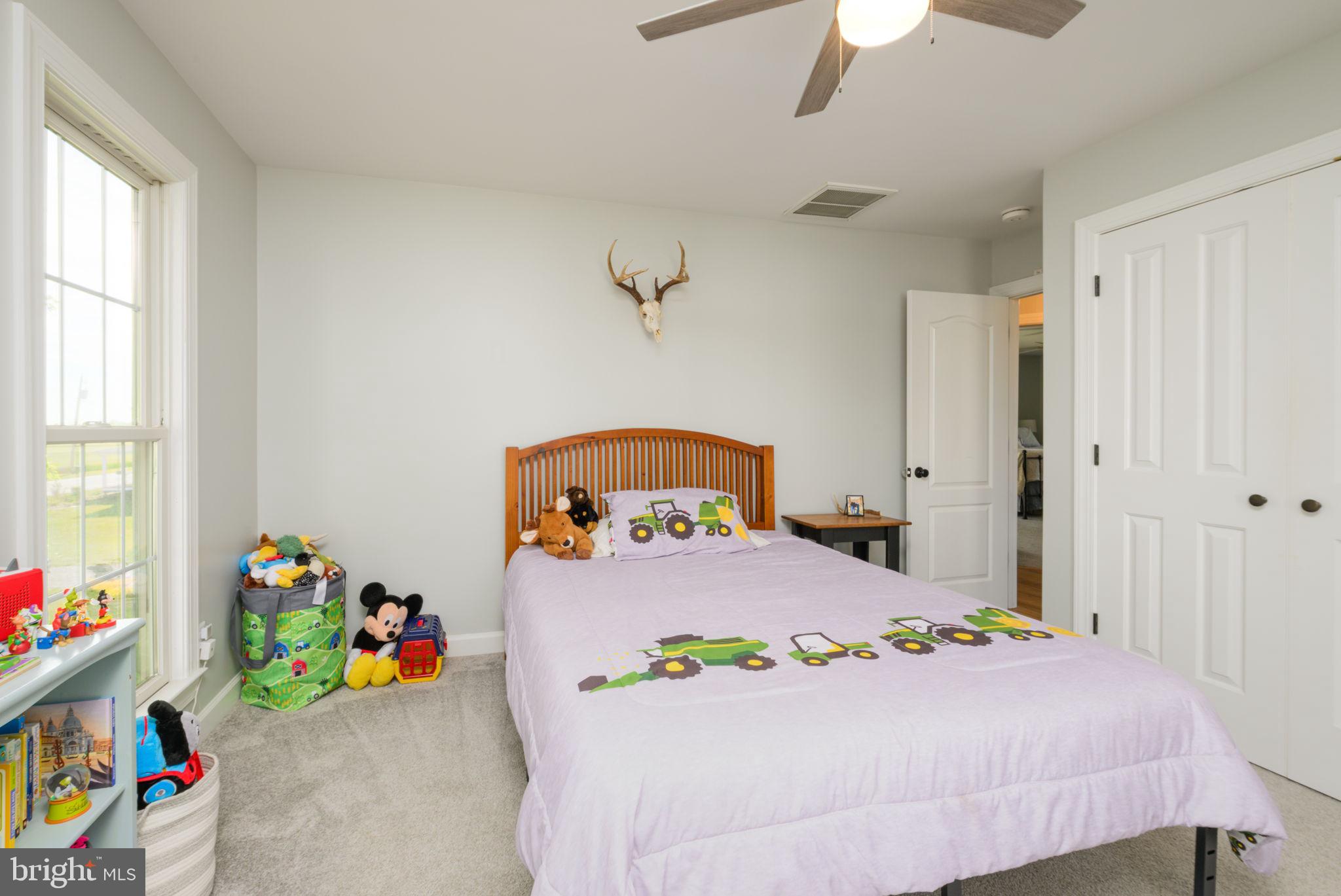 2649 Roberts Station Road Ingleside, MD 21644 - Photo 26 of 47 a bedroom with a bed and a window