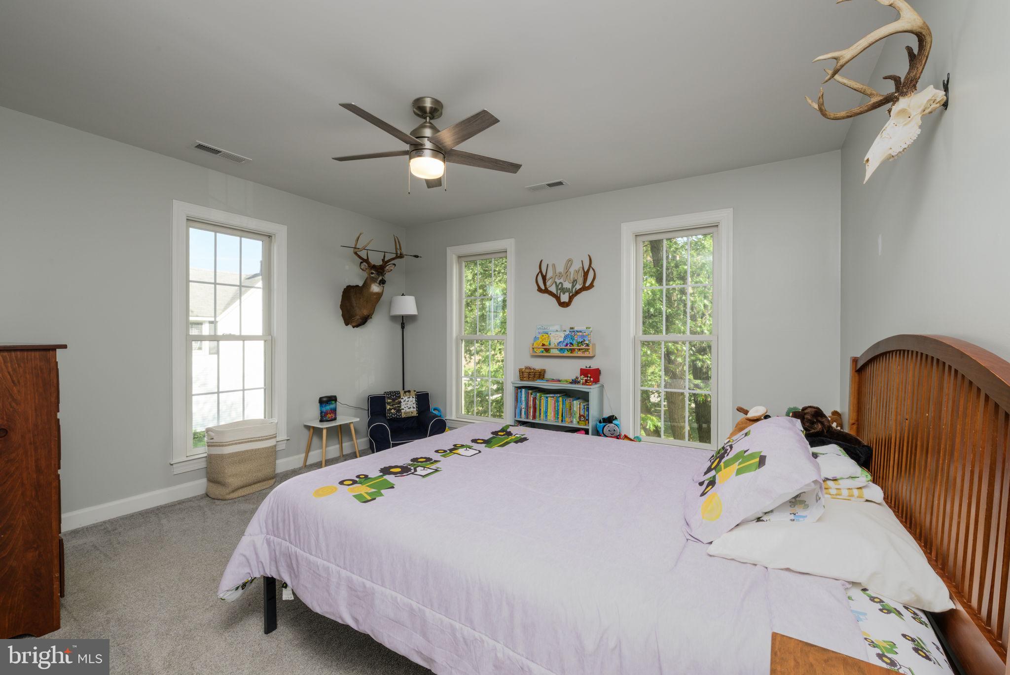 2649 Roberts Station Road Ingleside, MD 21644 - Photo 27 of 47 a bedroom with a bed next to a window