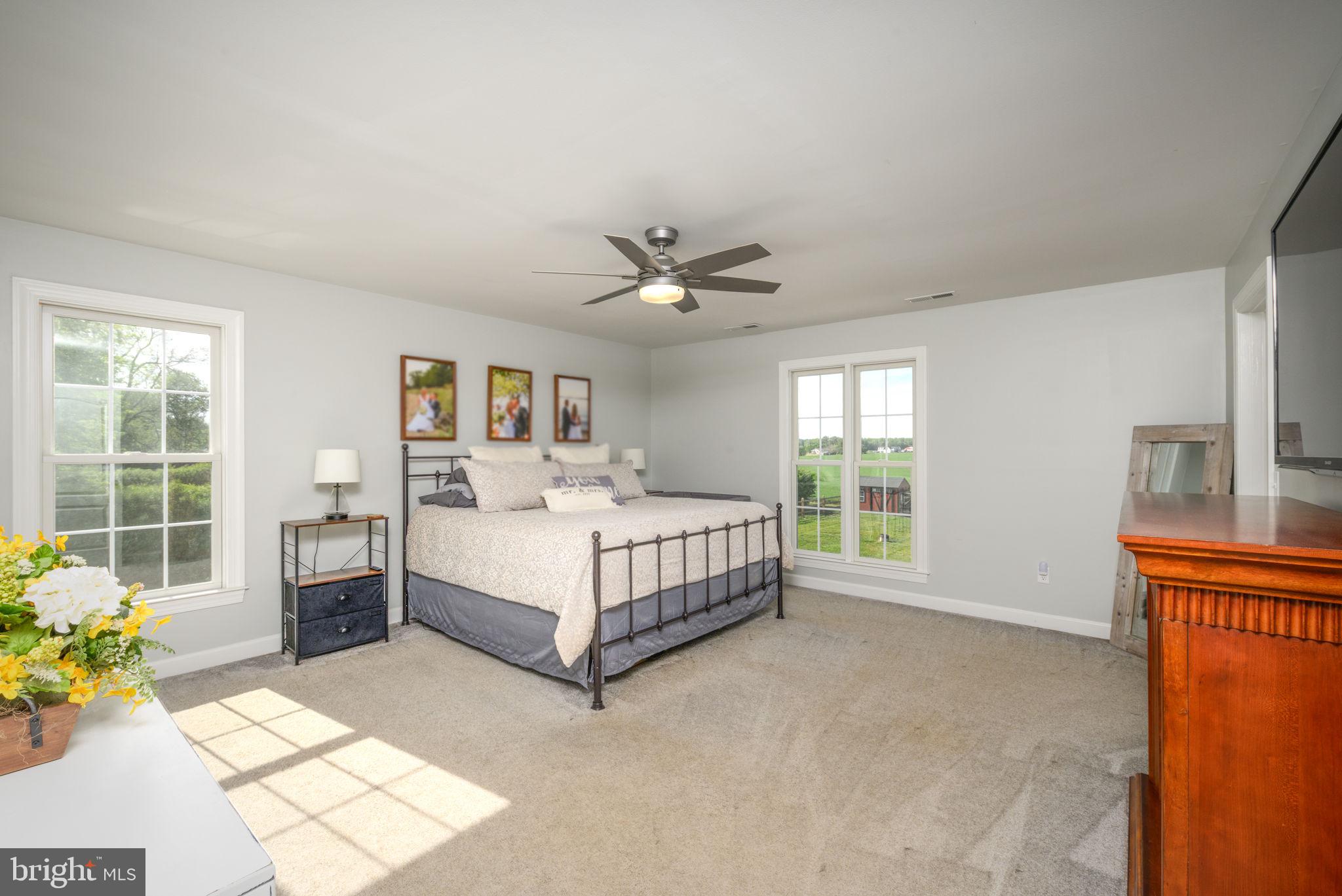 2649 Roberts Station Road Ingleside, MD 21644 - Photo 30 of 47 a spacious bedroom with a bed and a window