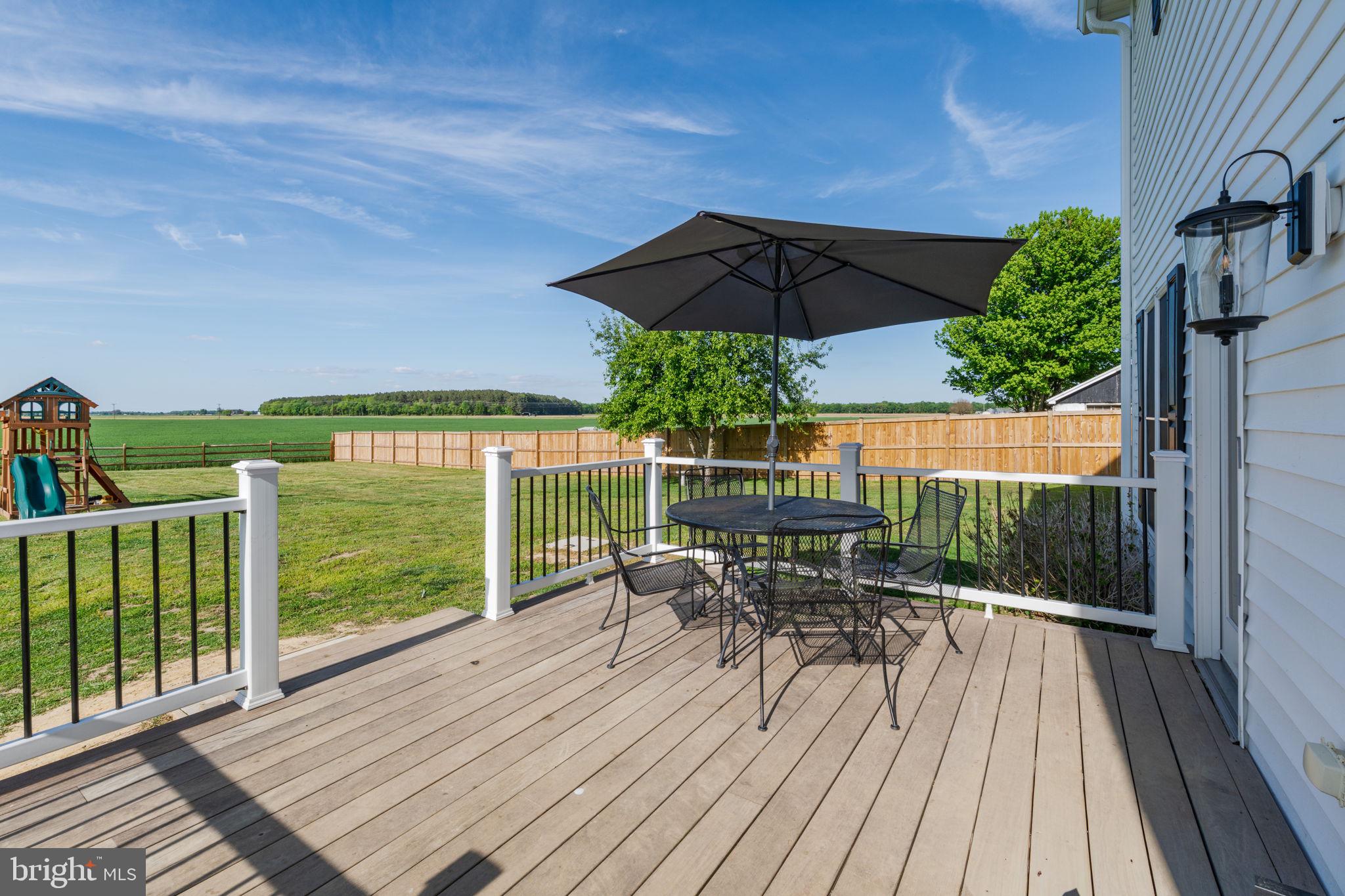 2649 Roberts Station Road Ingleside, MD 21644 - Photo 7 of 47 a view of a deck with wooden floor and outdoor seating