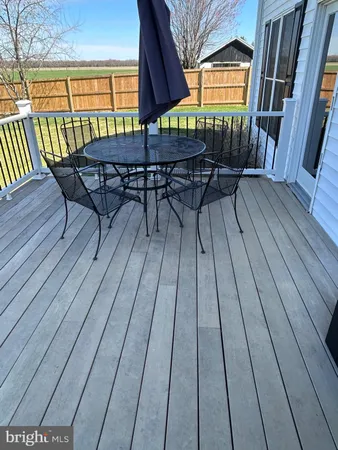 a view of a chairs on the roof deck