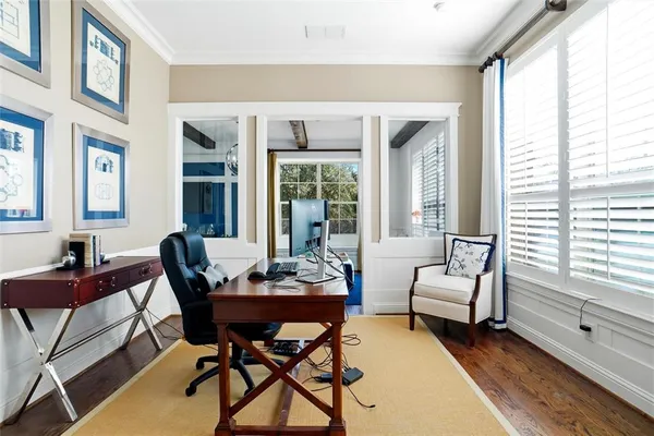 a dining room with furniture and window