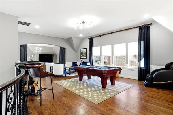 a view of a livingroom with furniture window and wooden floor