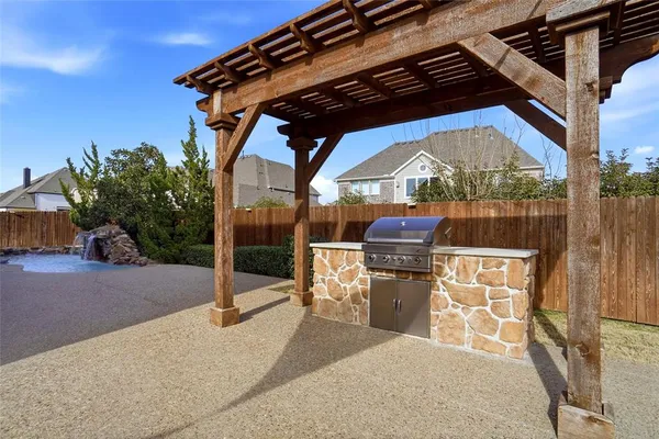 a view of swimming pool with a patio