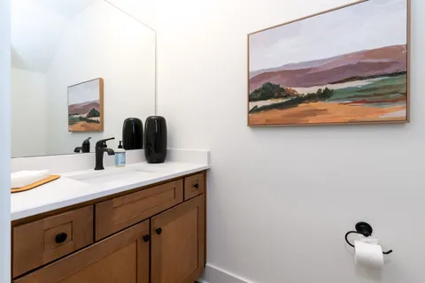 a bathroom with a sink a vanity and mirror