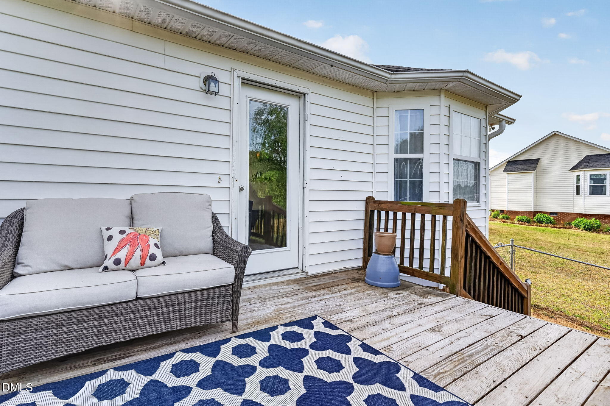 1101 Live Oak Road Coats, NC 27521 - Photo 22 of 29 a balcony with furniture and a rug