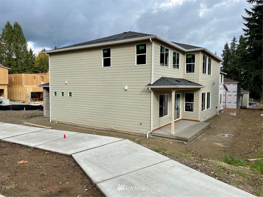 14 215th Street Southeast, Unit 13 Bothell, WA 98021 - Photo 2 of 15 a front view of a house with a yard
