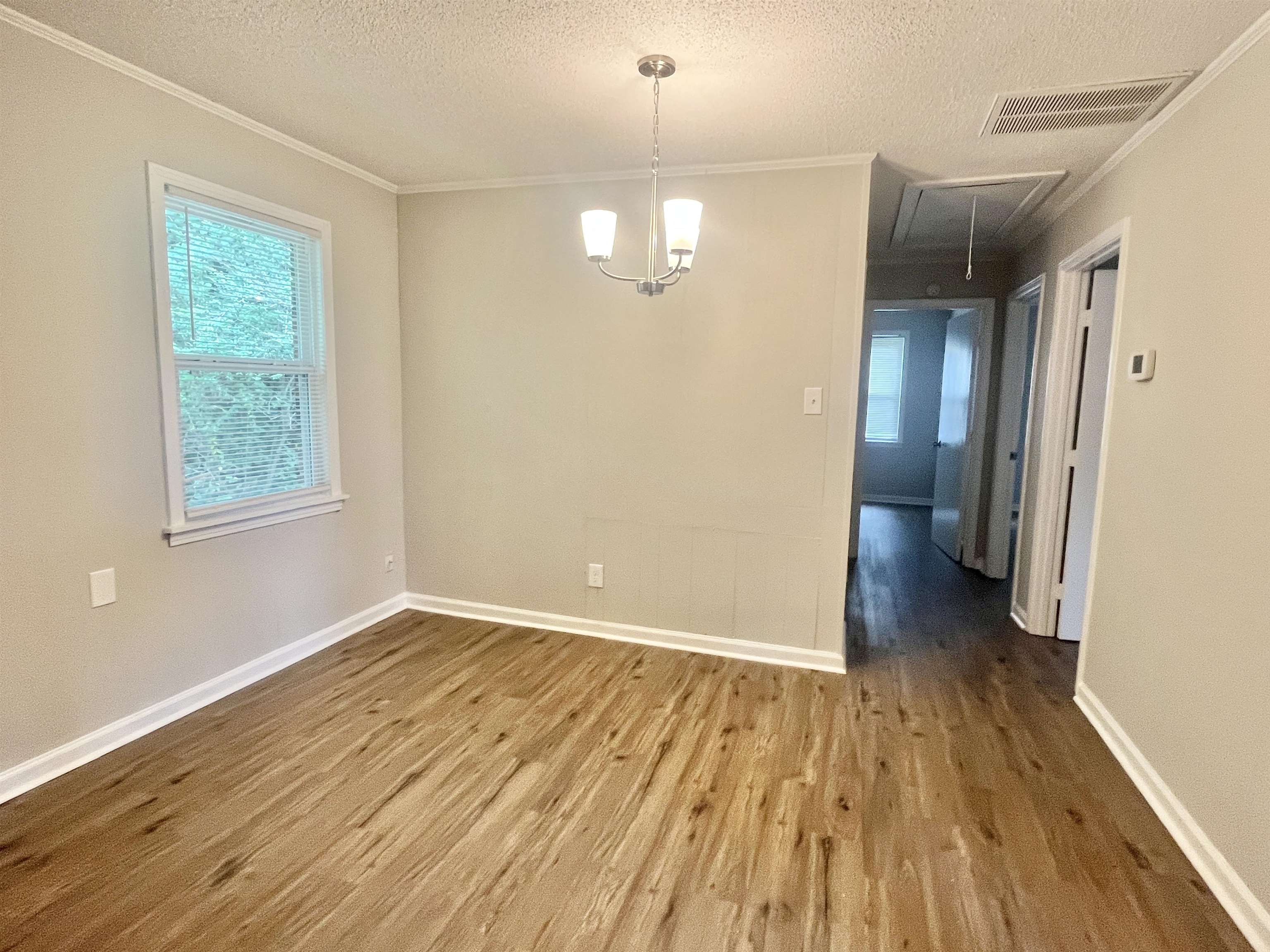 1172 Tabernacle Road Covington, TN 38019 - Photo 6 of 13 a view of livingroom with hardwood floor and window