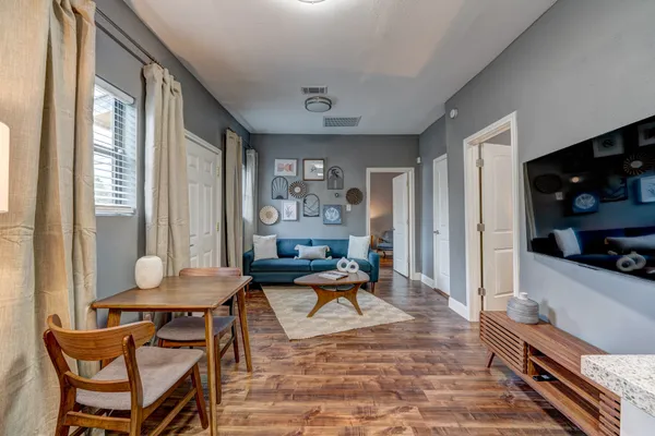 a living room with furniture and a window