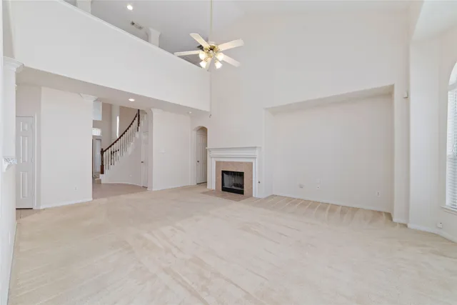 a kitchen with stainless steel appliances a kitchen island a stove a refrigerator a oven and white cabinets