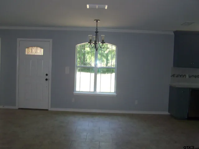 a kitchen with window and fireplace