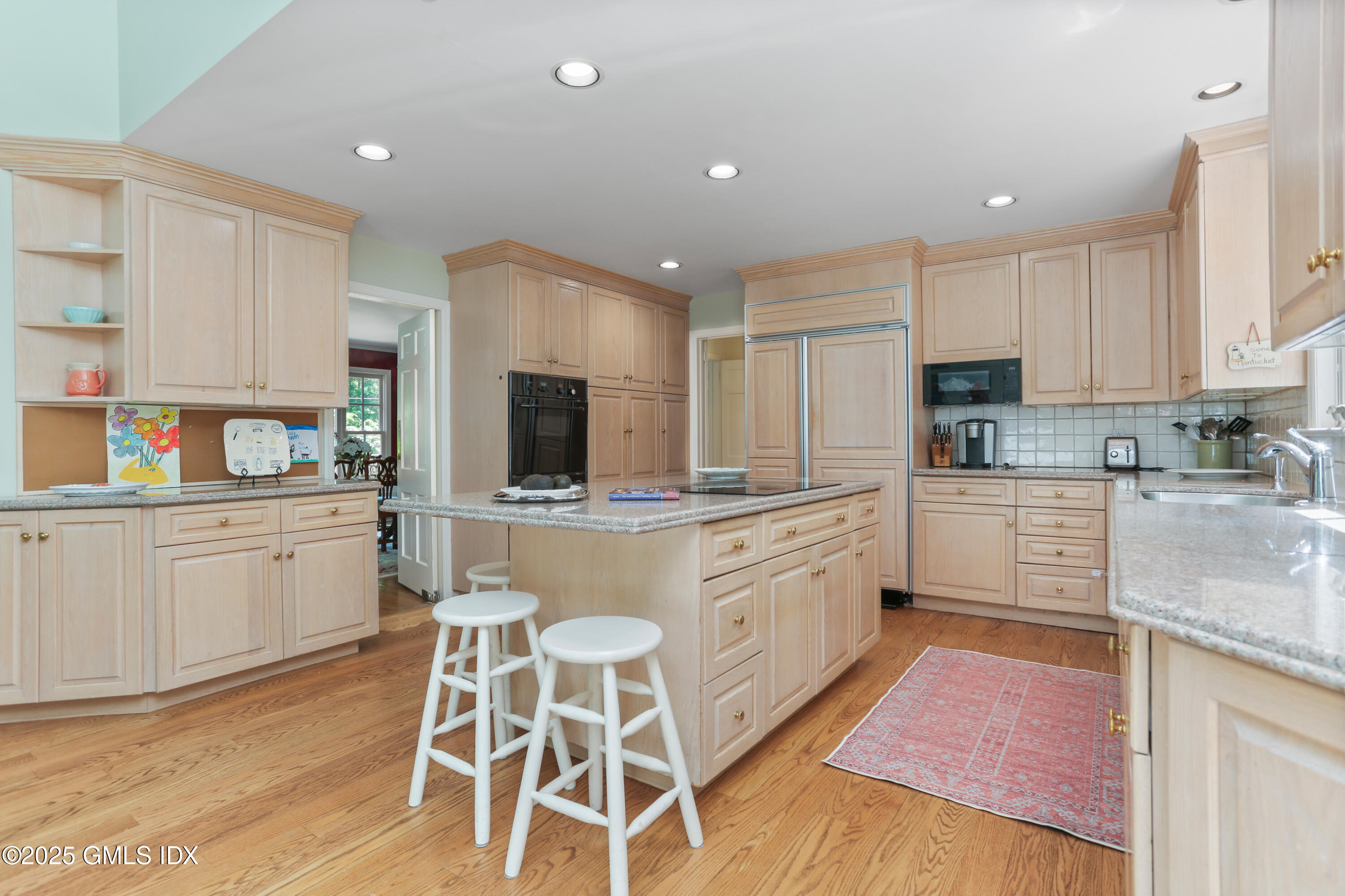 36 Horseshoe Road Cos Cob, CT 06807 - Photo 11 of 39 a kitchen with stainless steel appliances granite countertop a sink and cabinets