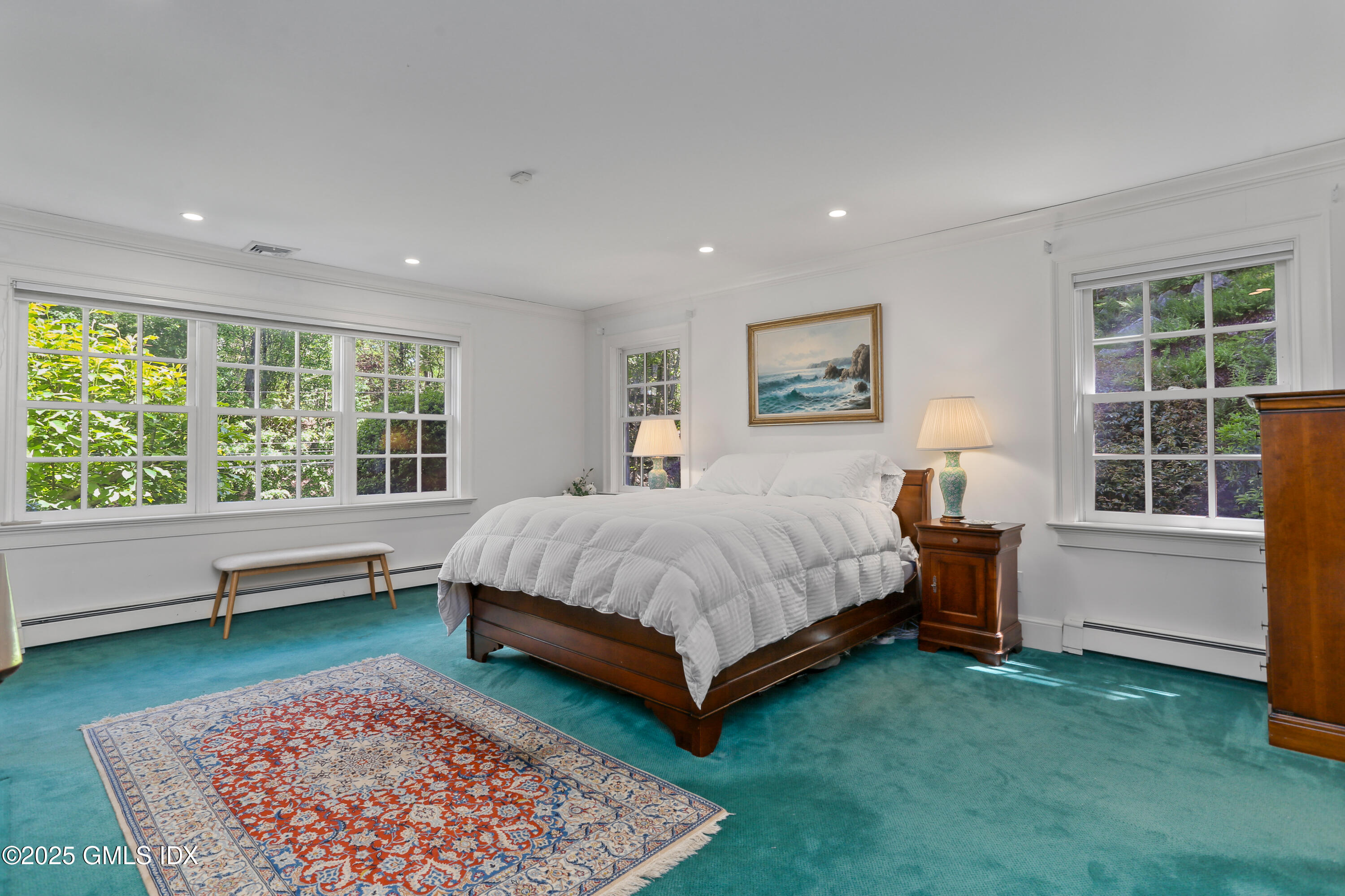 36 Horseshoe Road Cos Cob, CT 06807 - Photo 17 of 39 a spacious bedroom with a bed and a large window
