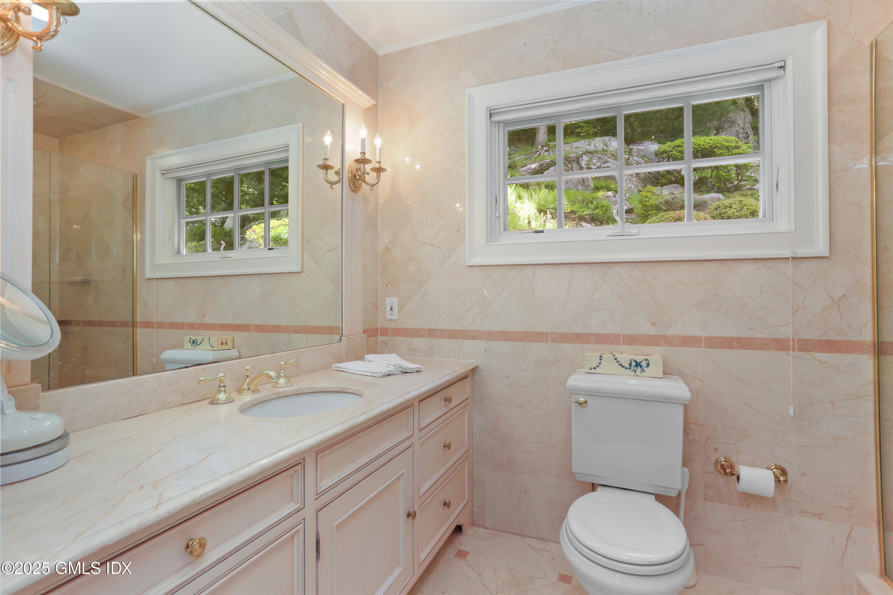 36 Horseshoe Road Cos Cob, CT 06807 - Photo 18 of 39 a bathroom with a toilet a sink a window and mirror