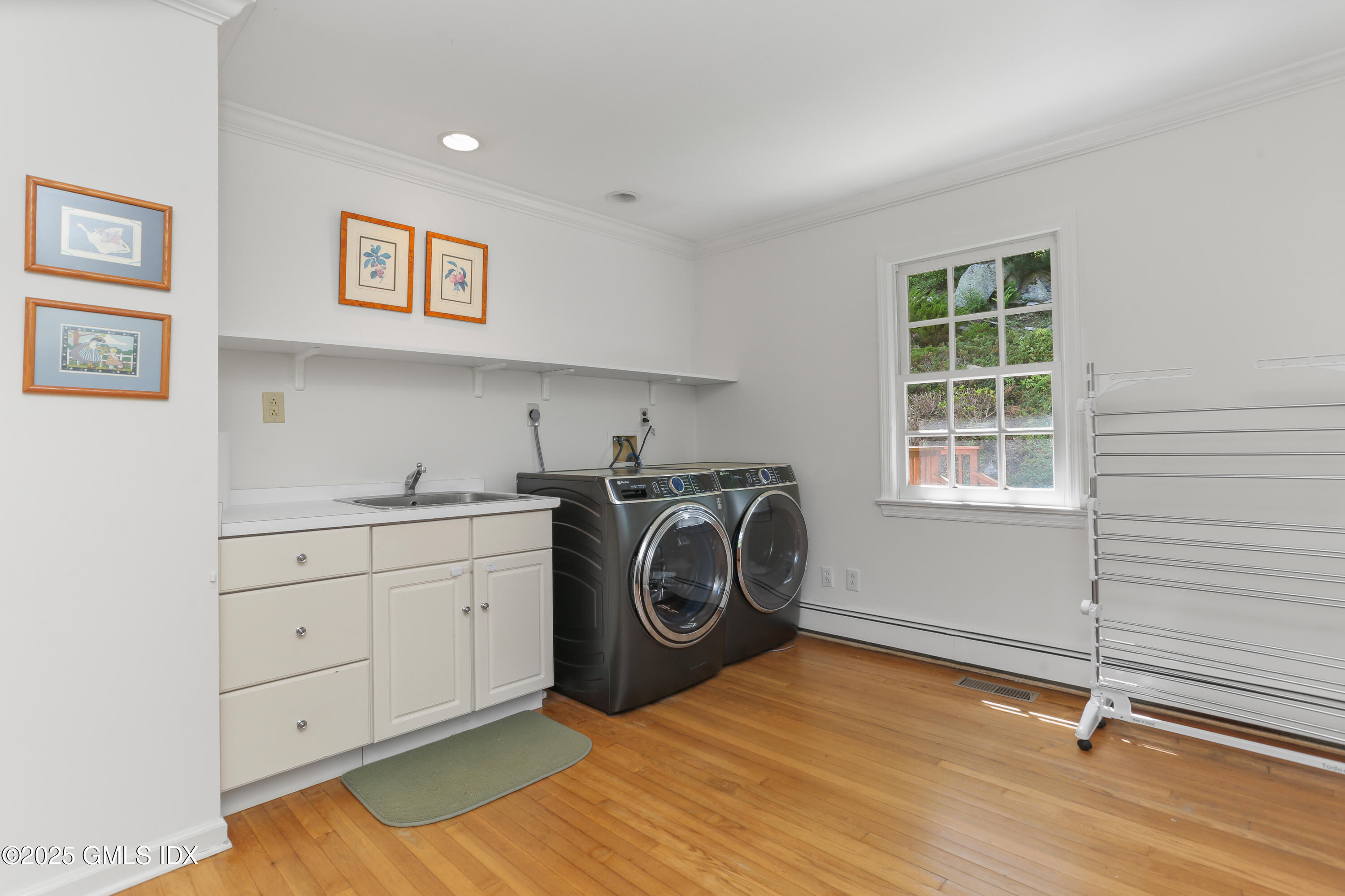 36 Horseshoe Road Cos Cob, CT 06807 - Photo 19 of 39 a utility room with sink dryer and washer