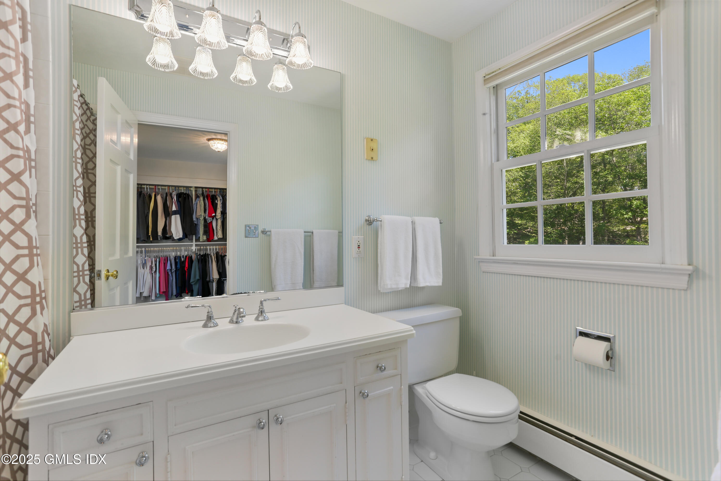 36 Horseshoe Road Cos Cob, CT 06807 - Photo 22 of 39 a bathroom with a sink a mirror and a toilet