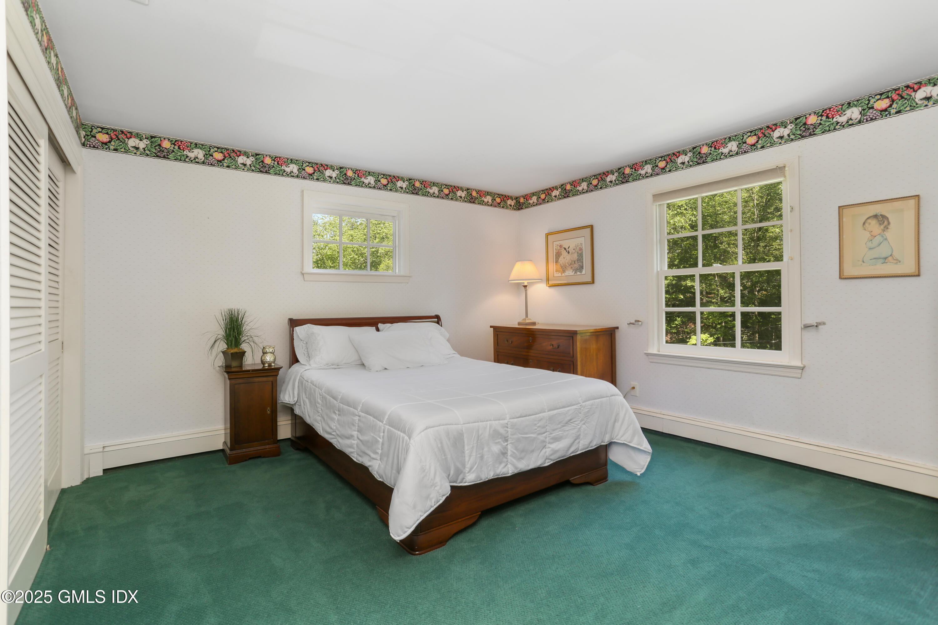 36 Horseshoe Road Cos Cob, CT 06807 - Photo 23 of 39 a bed sitting in a bedroom next to a window