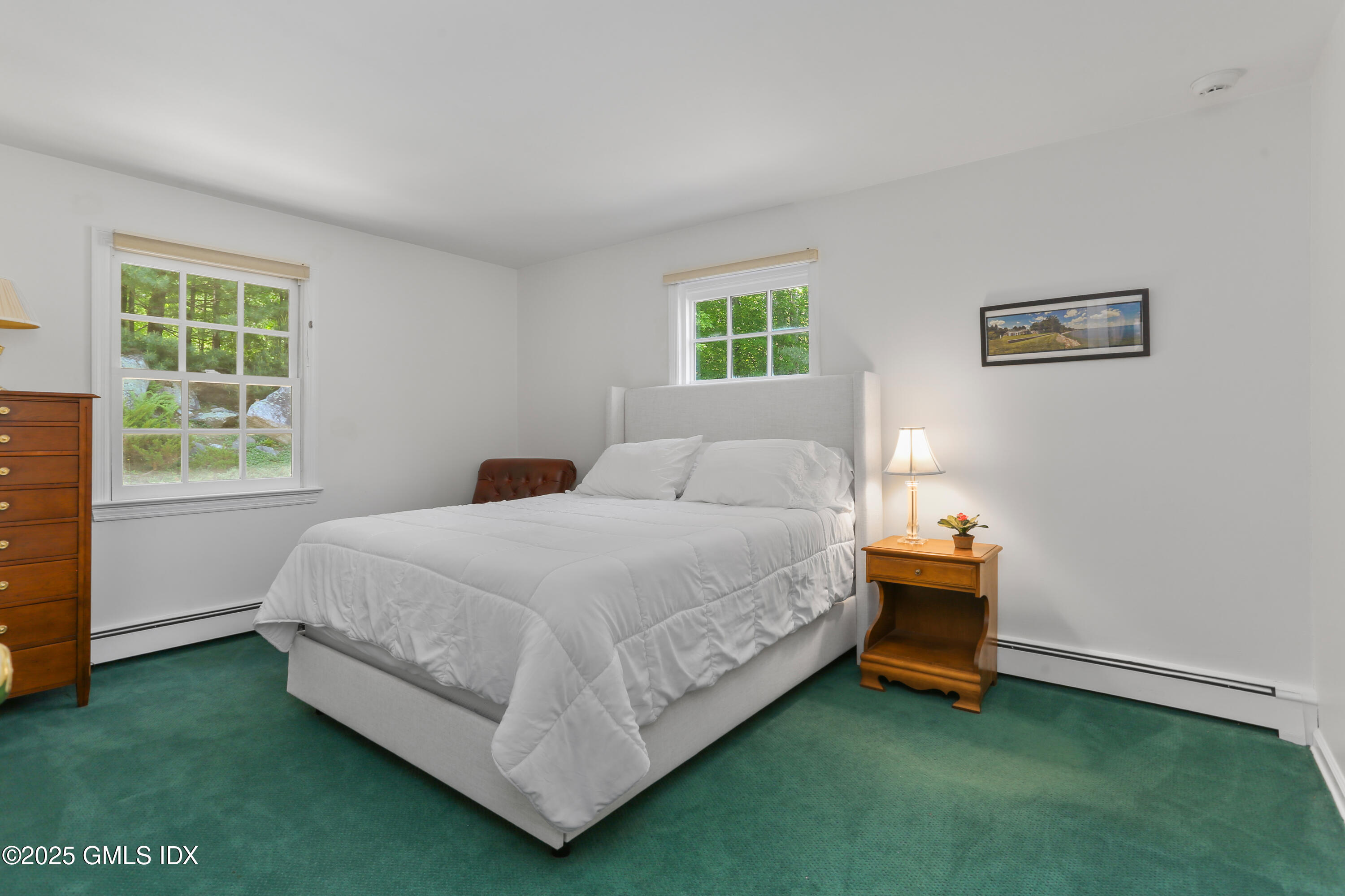 36 Horseshoe Road Cos Cob, CT 06807 - Photo 25 of 39 a bed sitting in a bedroom next to a window