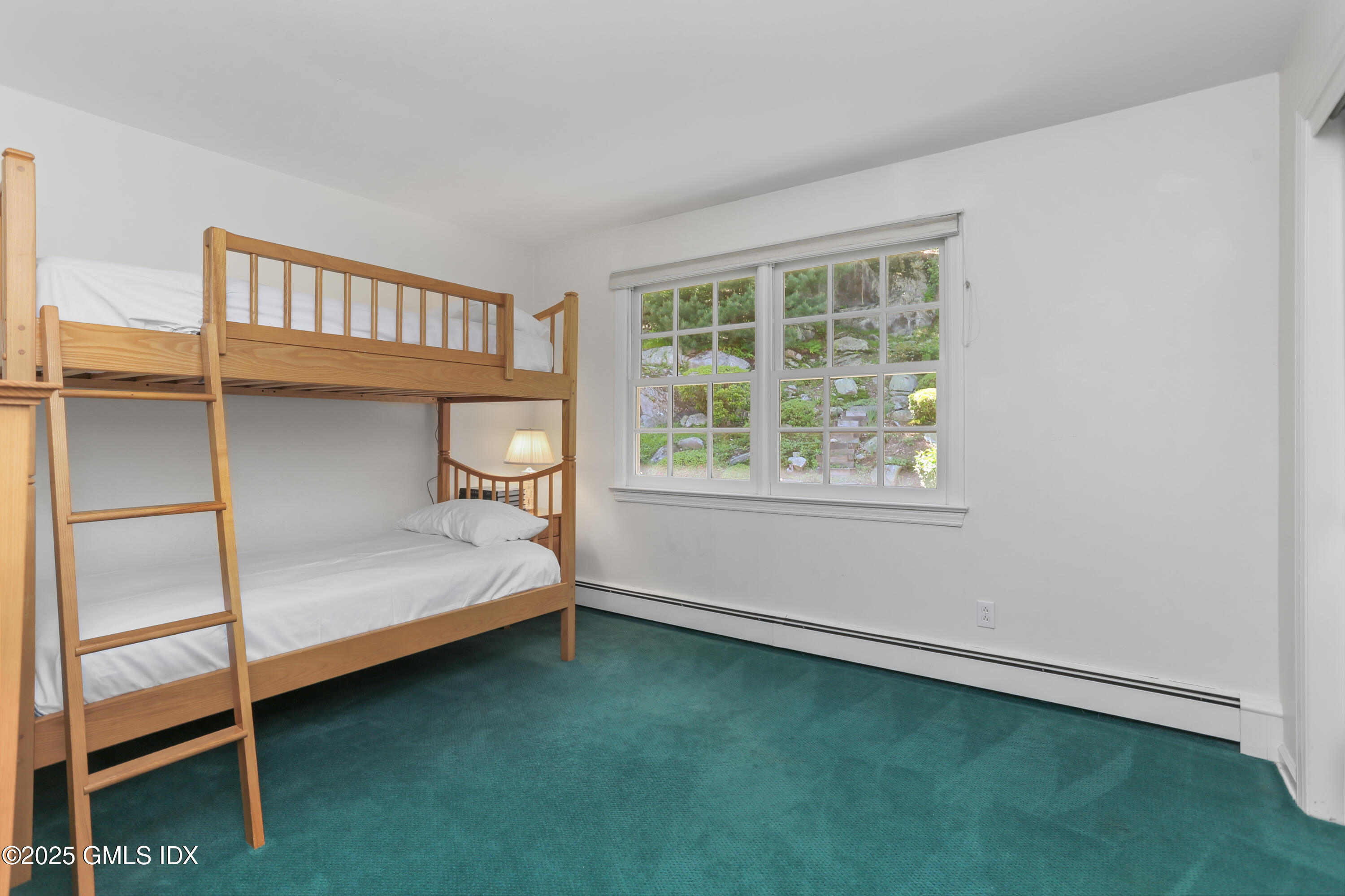 36 Horseshoe Road Cos Cob, CT 06807 - Photo 26 of 39 a bedroom with a bed and a window