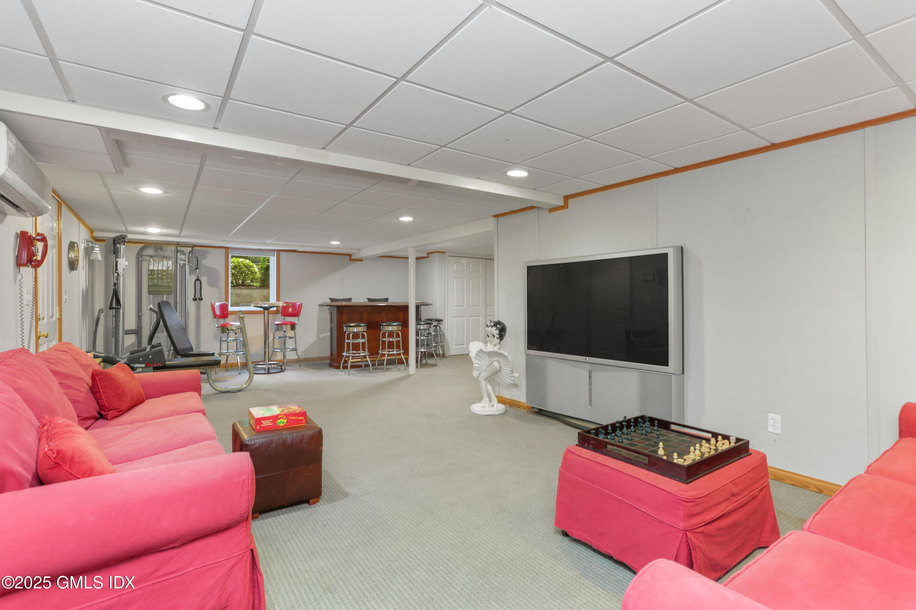 36 Horseshoe Road Cos Cob, CT 06807 - Photo 27 of 39 a living room with furniture and a flat screen tv