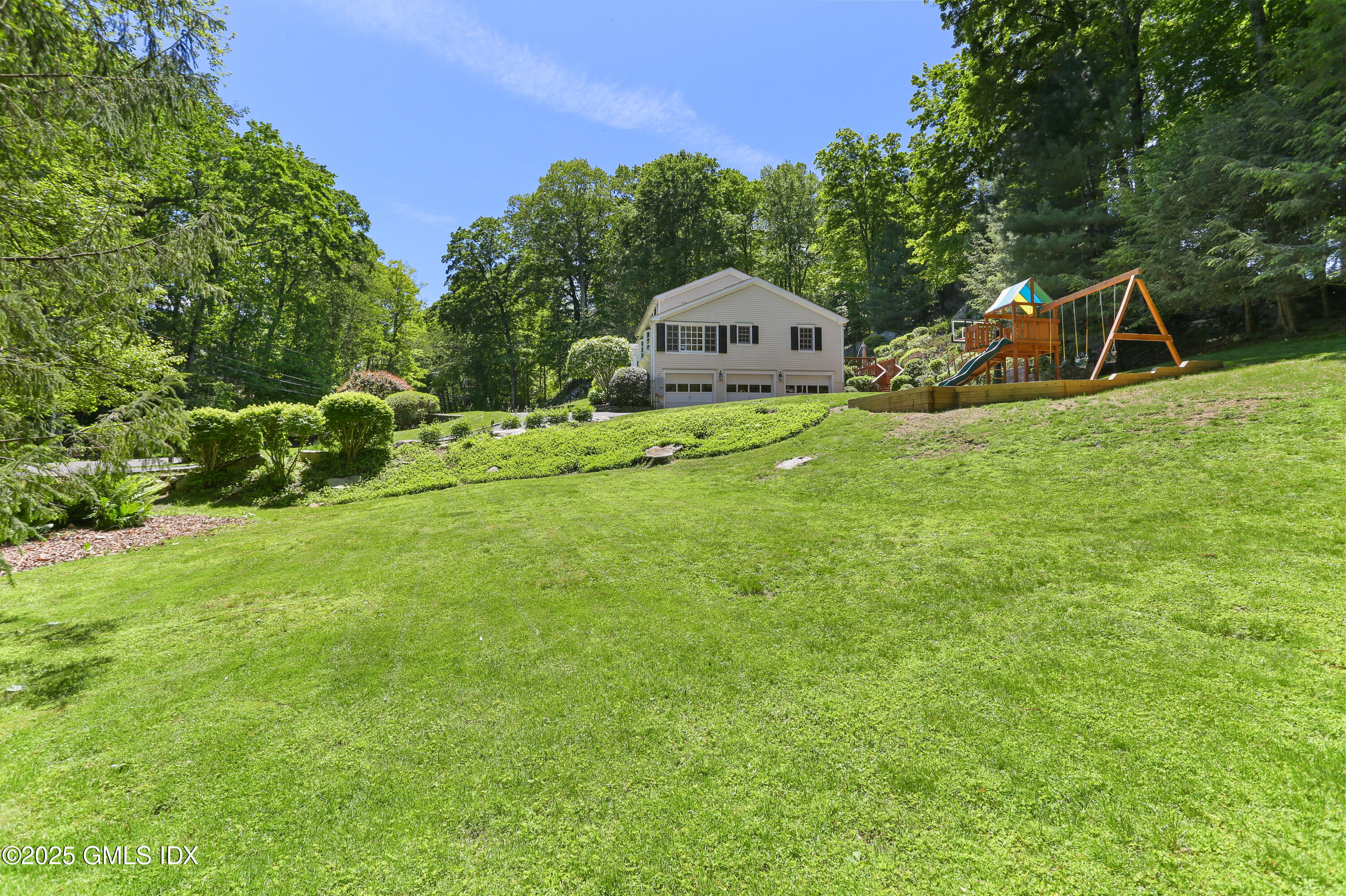 36 Horseshoe Road Cos Cob, CT 06807 - Photo 31 of 39 a view of a house with a yard and sitting area
