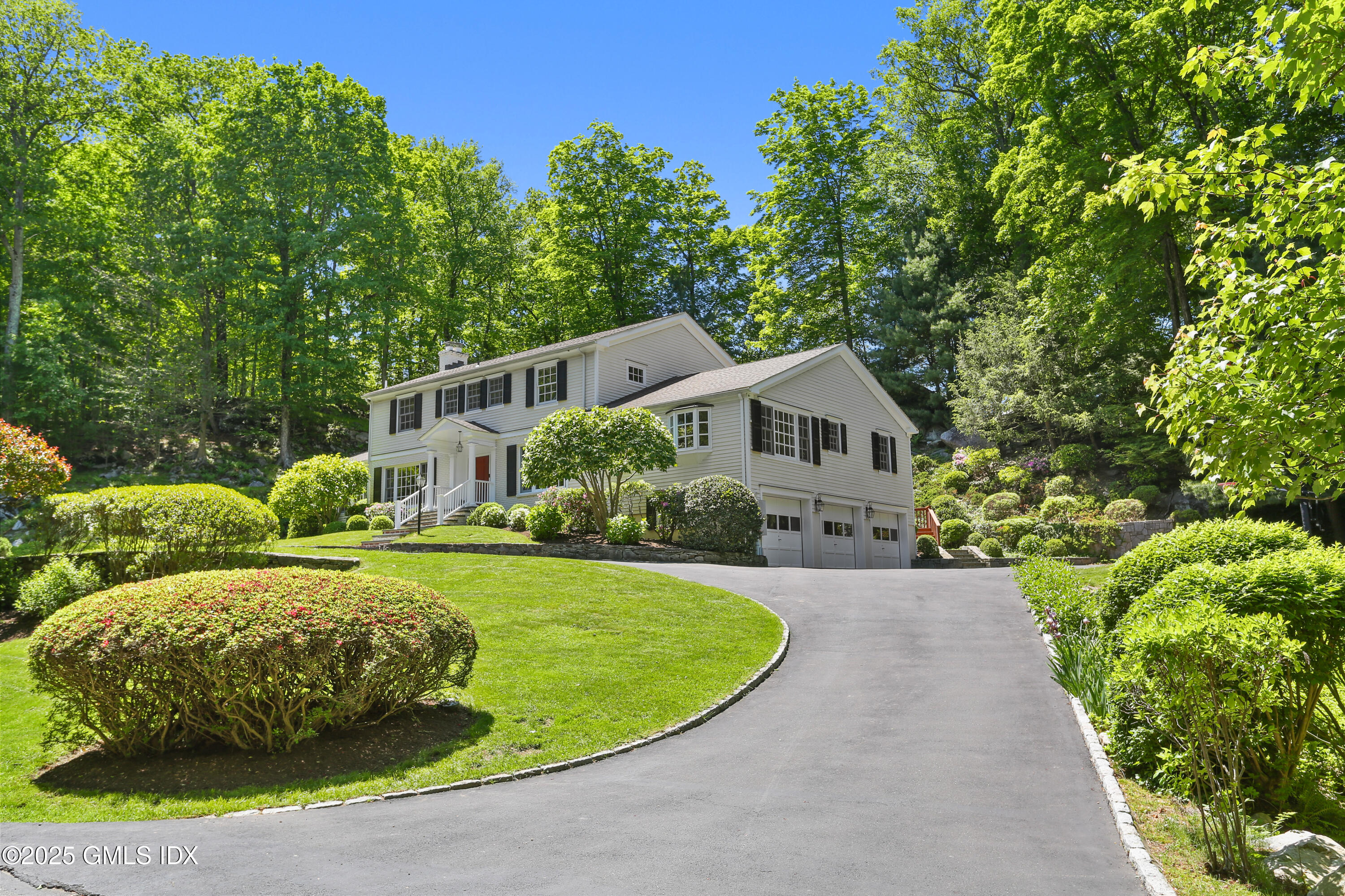 36 Horseshoe Road Cos Cob, CT 06807 - Photo 34 of 39 a front view of a house with garden