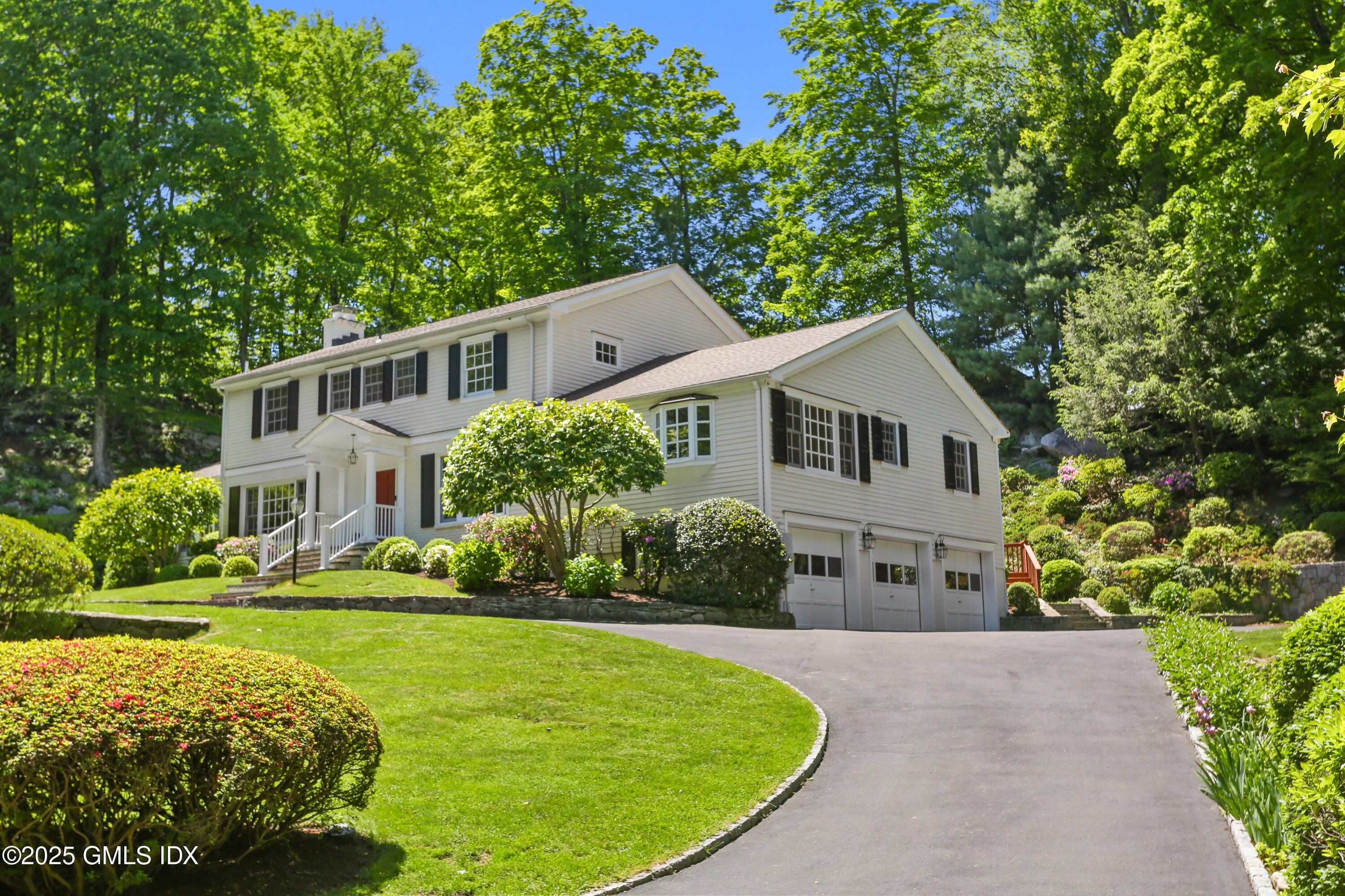 36 Horseshoe Road Cos Cob, CT 06807 - Photo 35 of 39 a aerial view of a house with a yard table and chairs