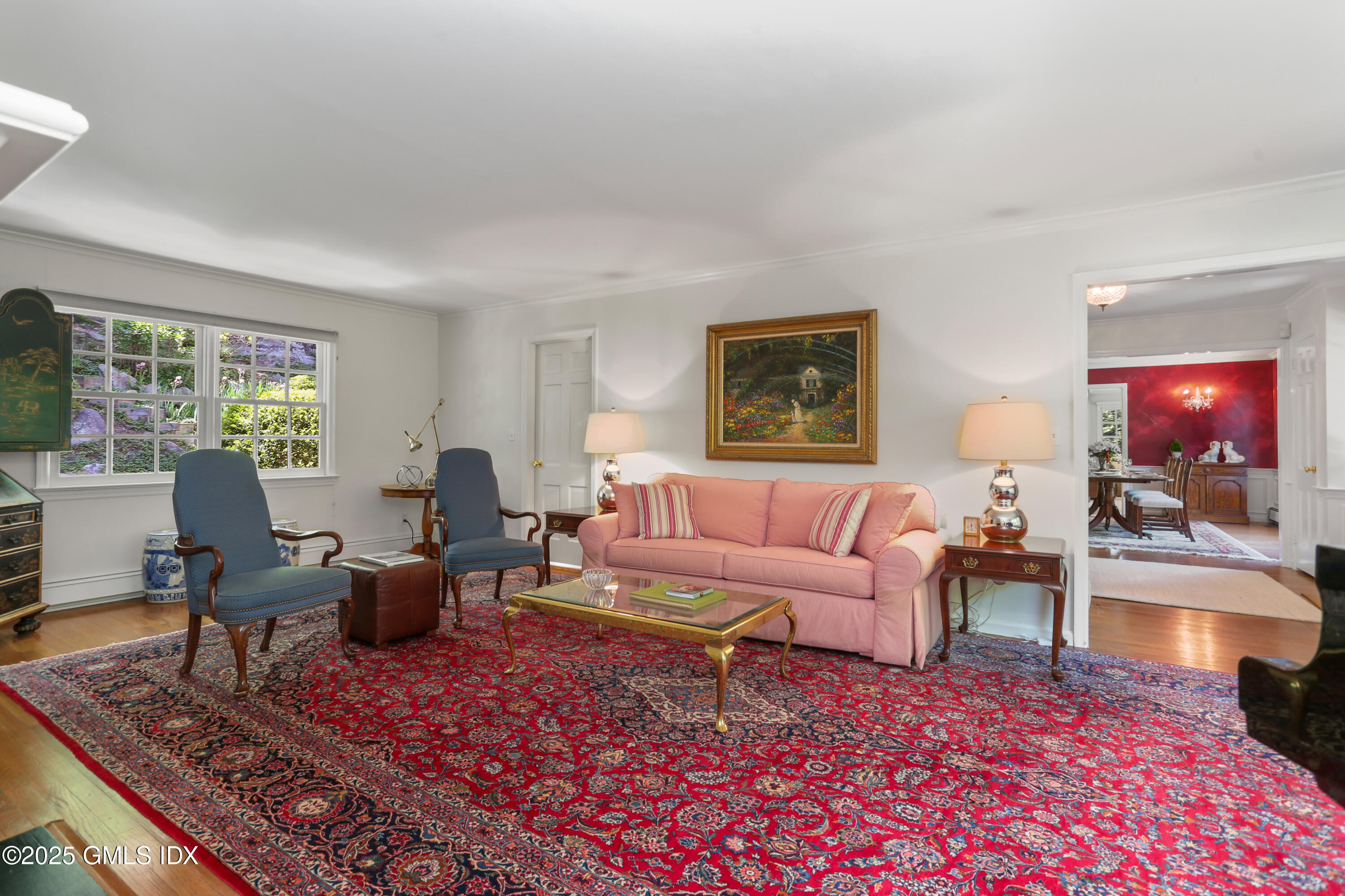 36 Horseshoe Road Cos Cob, CT 06807 - Photo 6 of 39 a living room with furniture a rug a lamp and a window