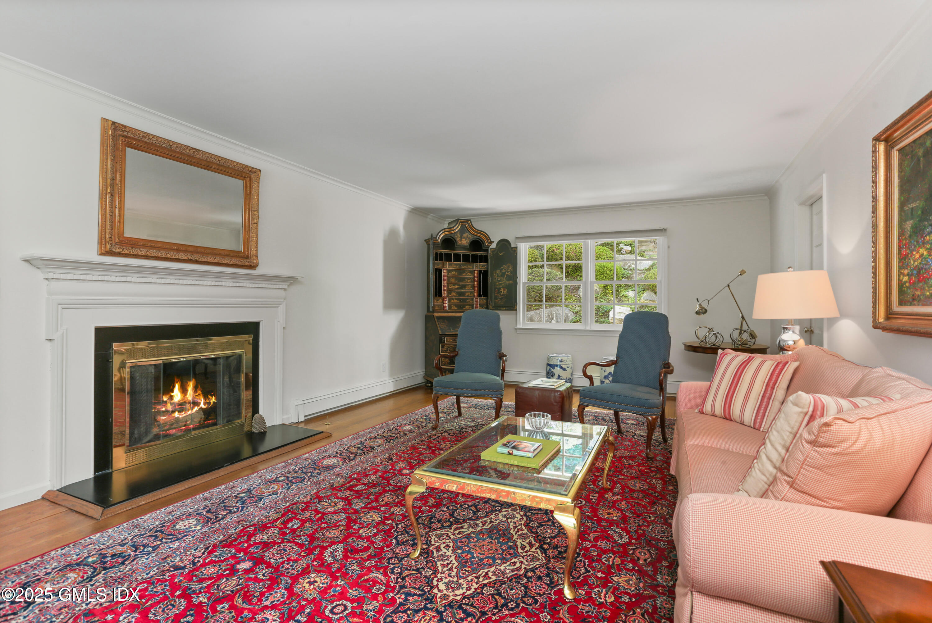 36 Horseshoe Road Cos Cob, CT 06807 - Photo 7 of 39 a living room with furniture a window and a fireplace