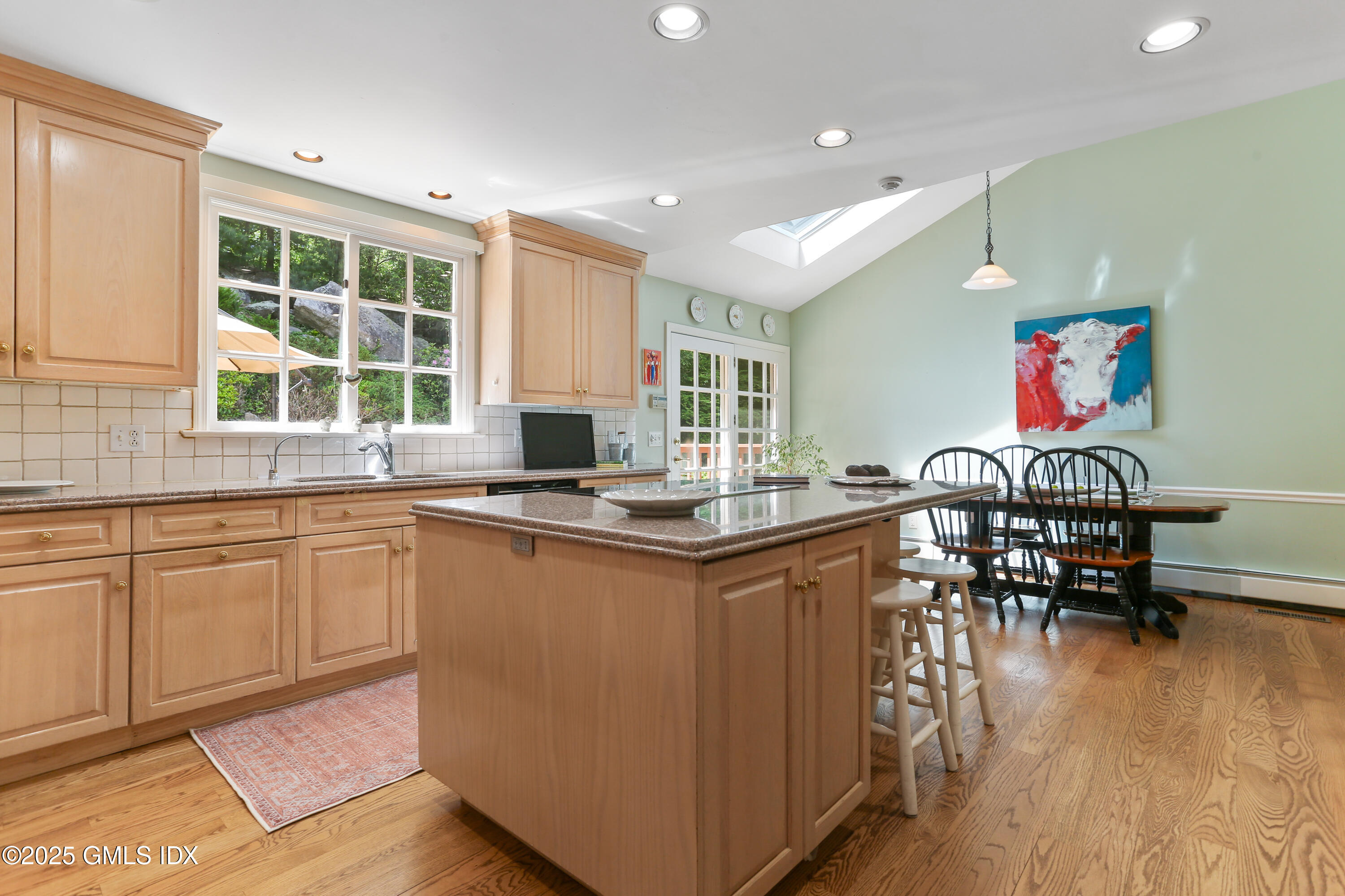 36 Horseshoe Road Cos Cob, CT 06807 - Photo 10 of 39 a kitchen with stainless steel appliances granite countertop sink stove and wooden cabinets