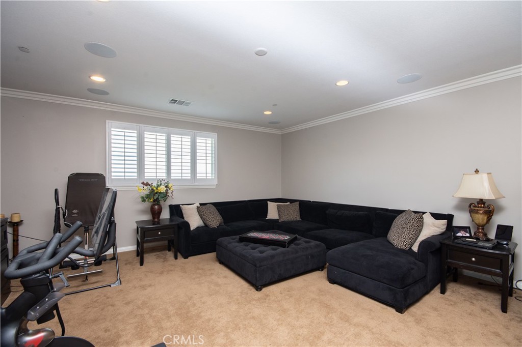 11950 Flicker Cove Corona, CA 92883 - Photo 16 of 28 a living room with furniture window and a flat screen tv