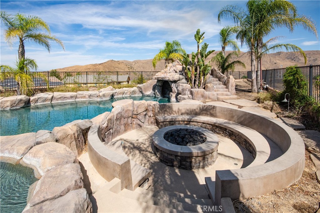 11950 Flicker Cove Corona, CA 92883 - Photo 20 of 28 a view of swimming pool with outdoor seating