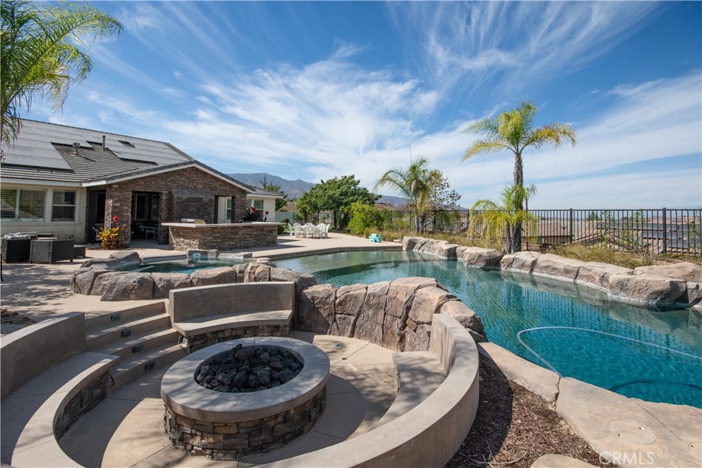 11950 Flicker Cove Corona, CA 92883 - Photo 21 of 28 a outdoor space with furniture and umbrella