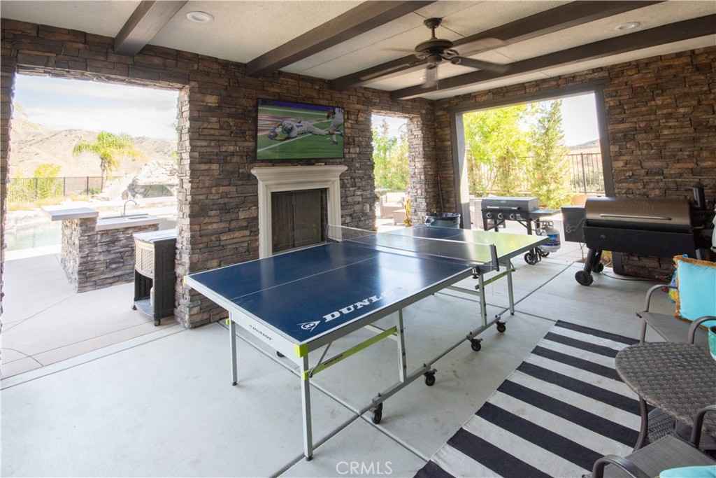 11950 Flicker Cove Corona, CA 92883 - Photo 23 of 28 a room with lots of furniture and a fireplace