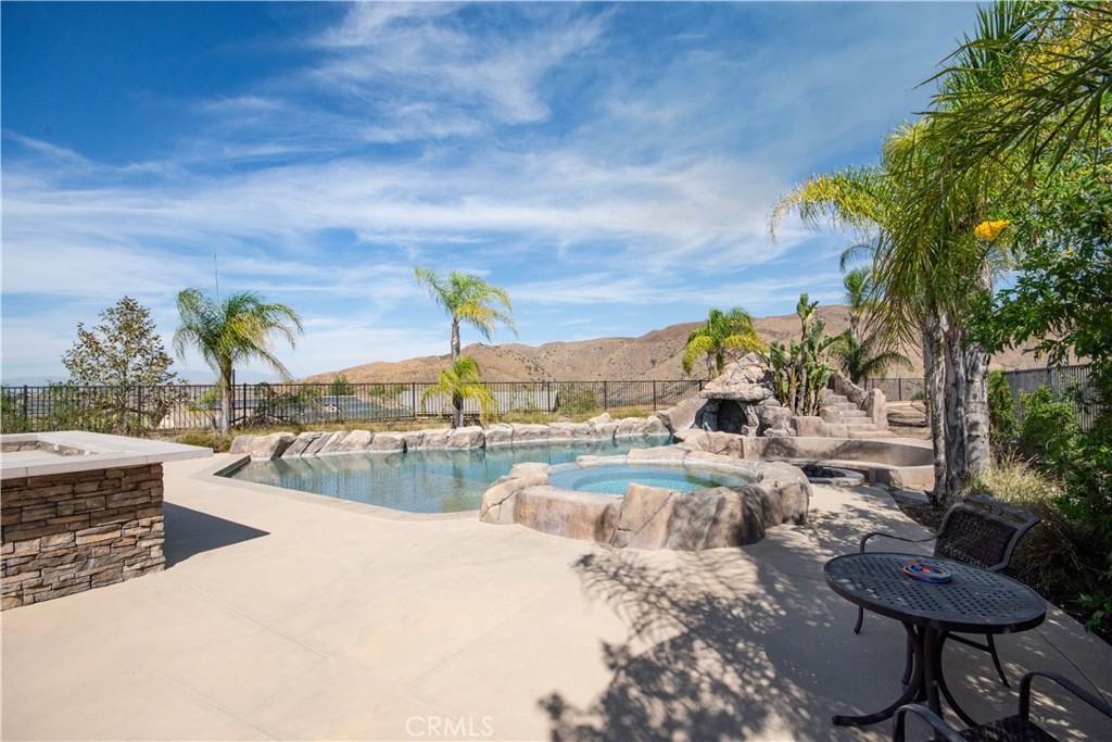 11950 Flicker Cove Corona, CA 92883 - Photo 26 of 28 a view of swimming pool with outdoor seating and plants