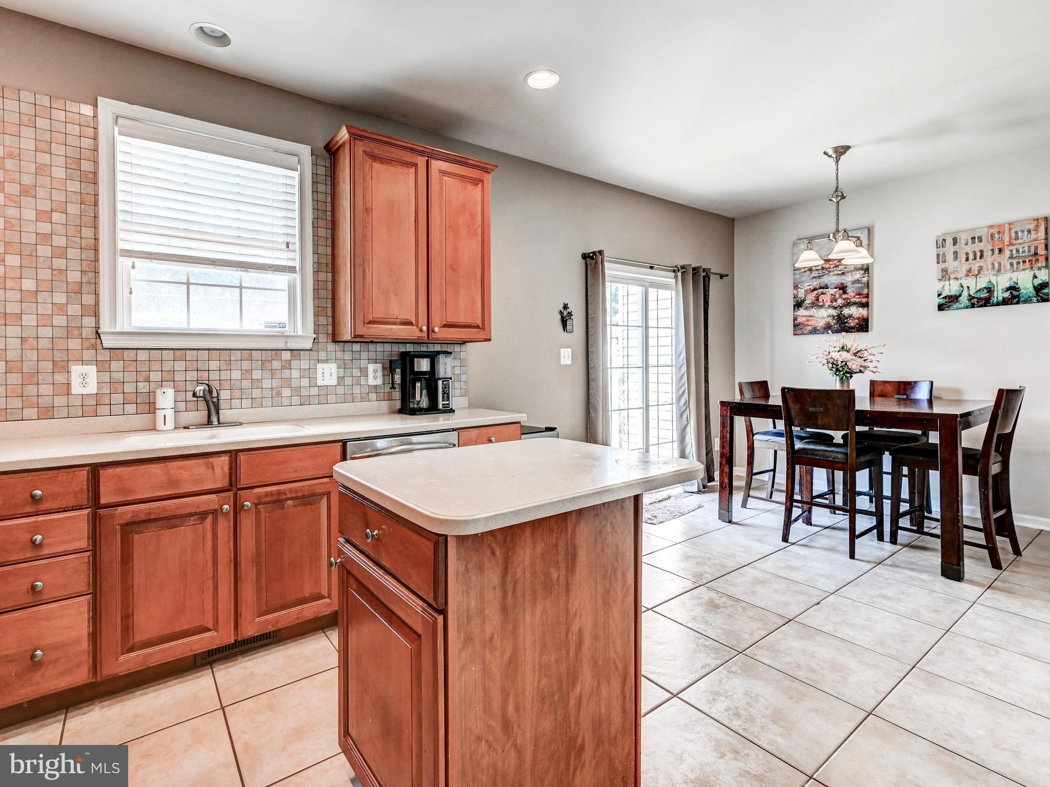 254 North Front Street New Freedom, PA 17349 - Photo 17 of 23 a kitchen with stainless steel appliances kitchen island granite countertop a sink and cabinets