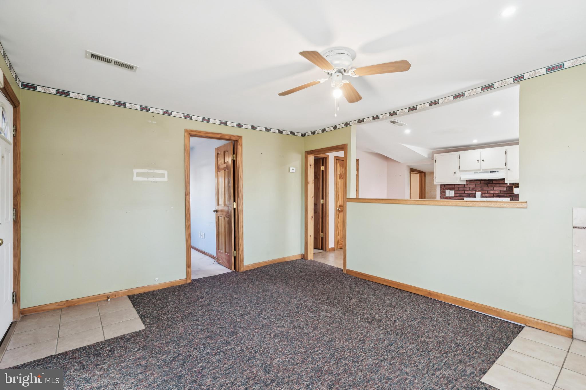 255 South Woodruff Road Bridgeton, NJ 08302 - Photo 7 of 25 a view of a livingroom with a ceiling fan and entryway
