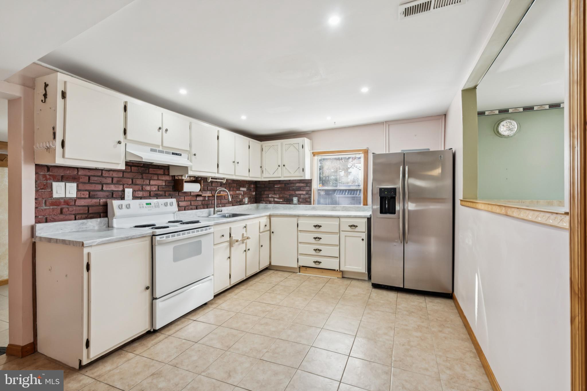 255 South Woodruff Road Bridgeton, NJ 08302 - Photo 8 of 25 a kitchen with stainless steel appliances granite countertop a refrigerator sink and cabinets