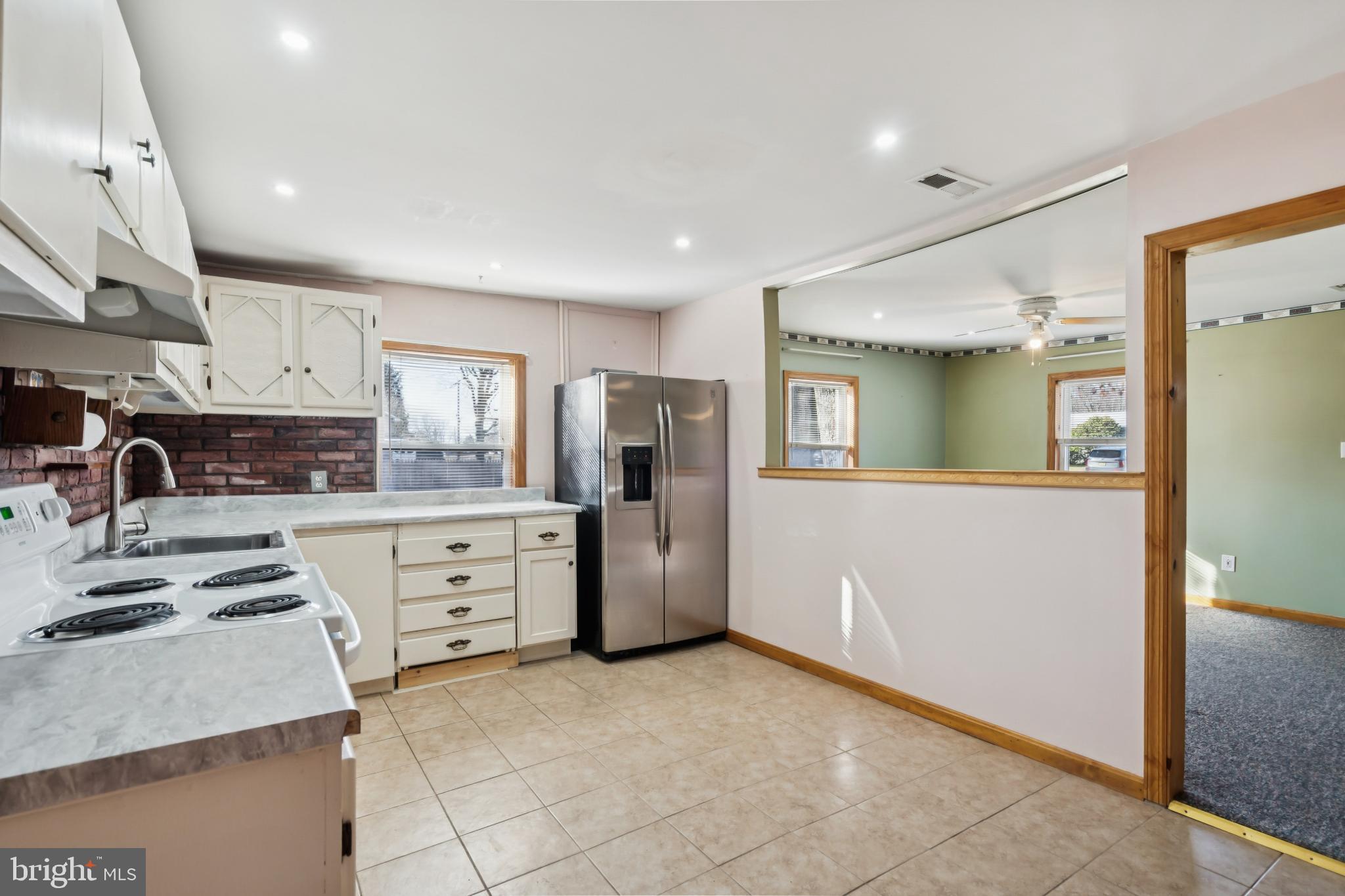 255 South Woodruff Road Bridgeton, NJ 08302 - Photo 10 of 25 a kitchen with refrigerator and cabinets