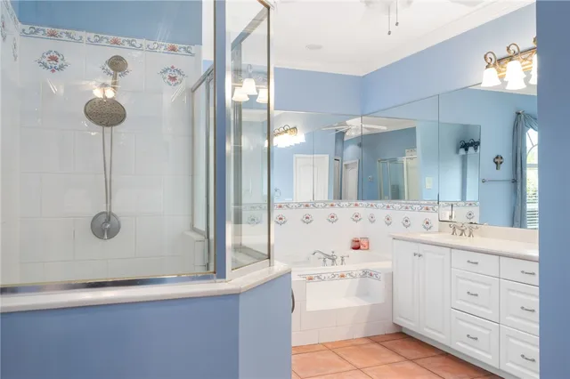a bathroom with a double vanity sink mirror and shower