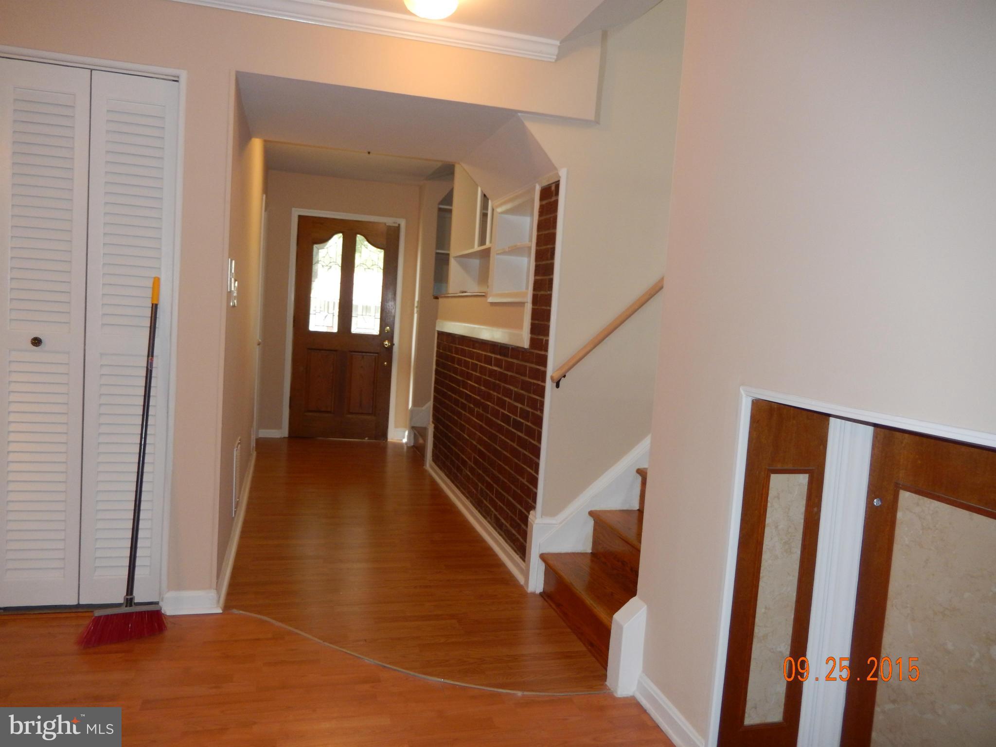 3922 Ilford Road Silver Spring, MD 20906 - Photo 11 of 30 a view of a hallway with wooden floor and staircase