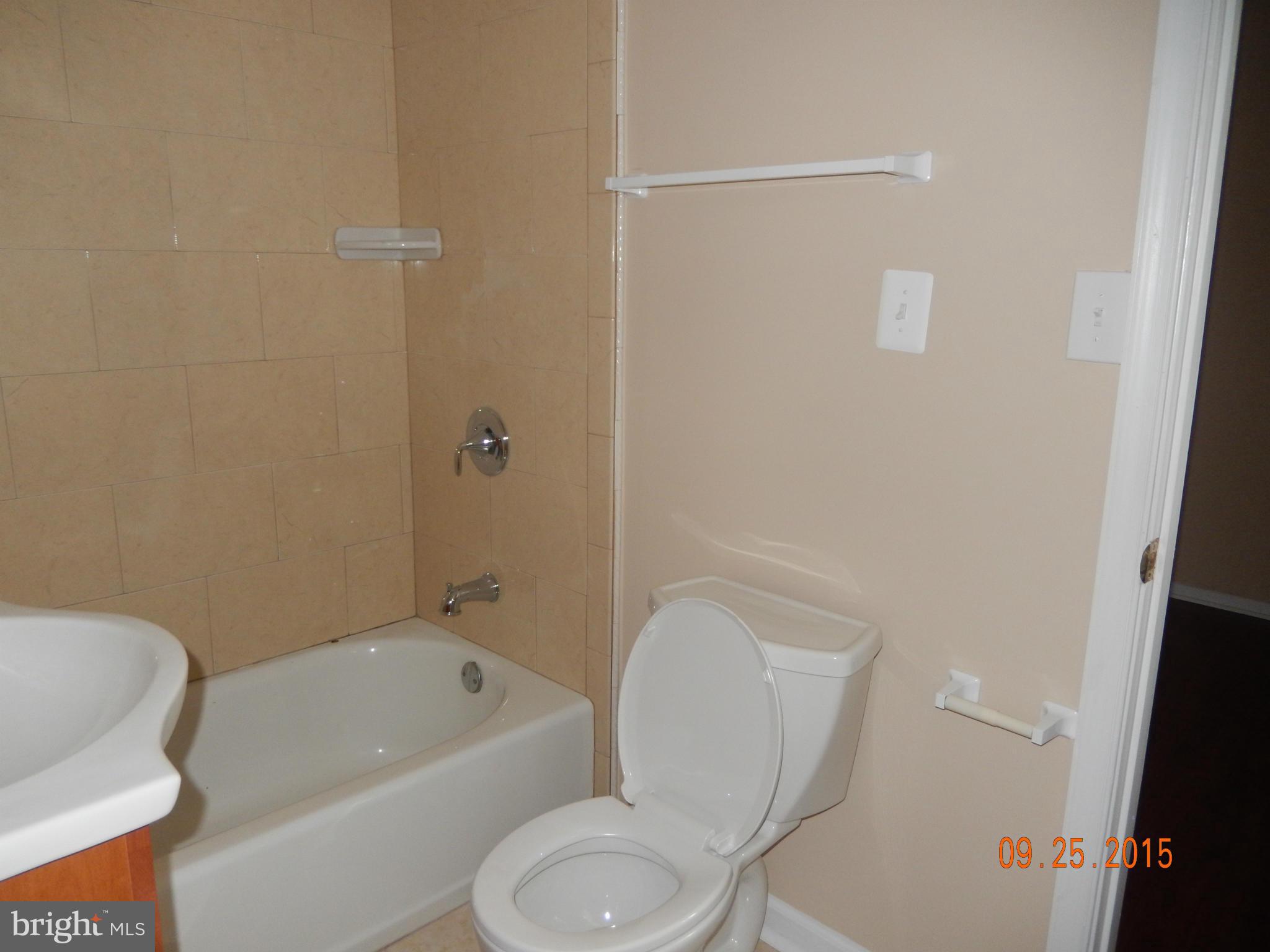 3922 Ilford Road Silver Spring, MD 20906 - Photo 7 of 30 a white toilet sitting next to a bath tub