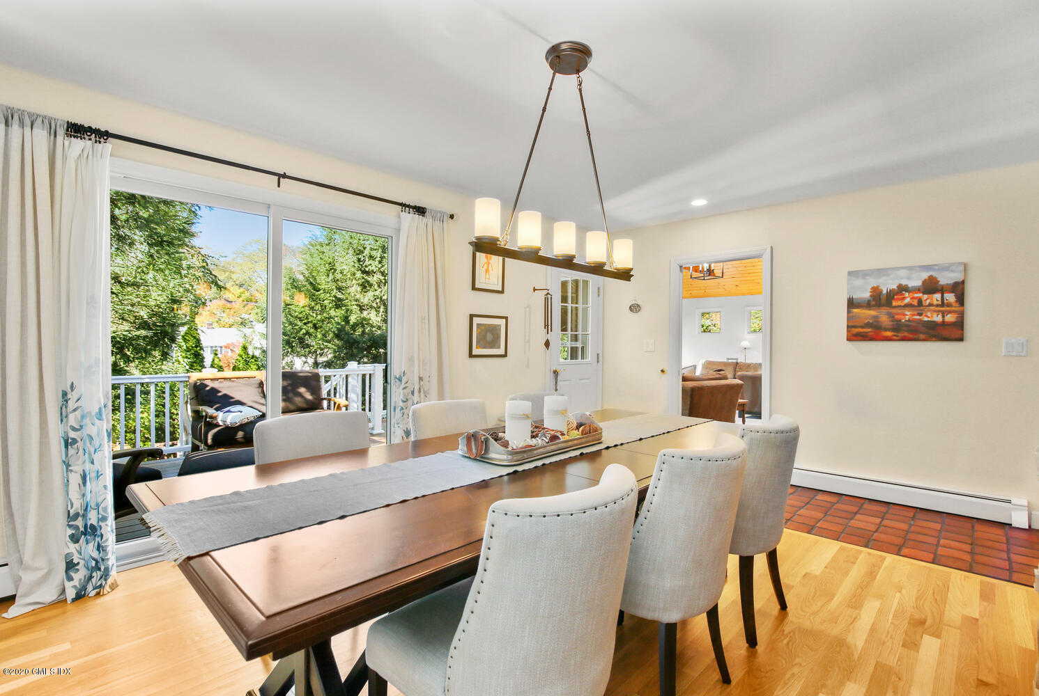 16 Ridge Road Cos Cob, CT 06807 - Photo 16 of 34 a dining room with furniture a chandelier and wooden floor