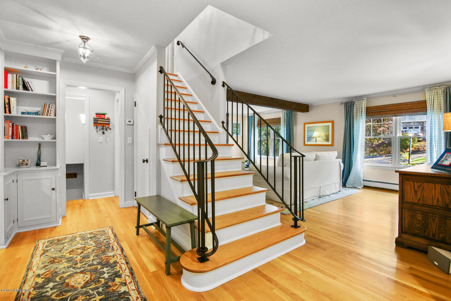16 Ridge Road Cos Cob, CT 06807 - Photo 4 of 34 a view of a livingroom with furniture stairs and a workspace